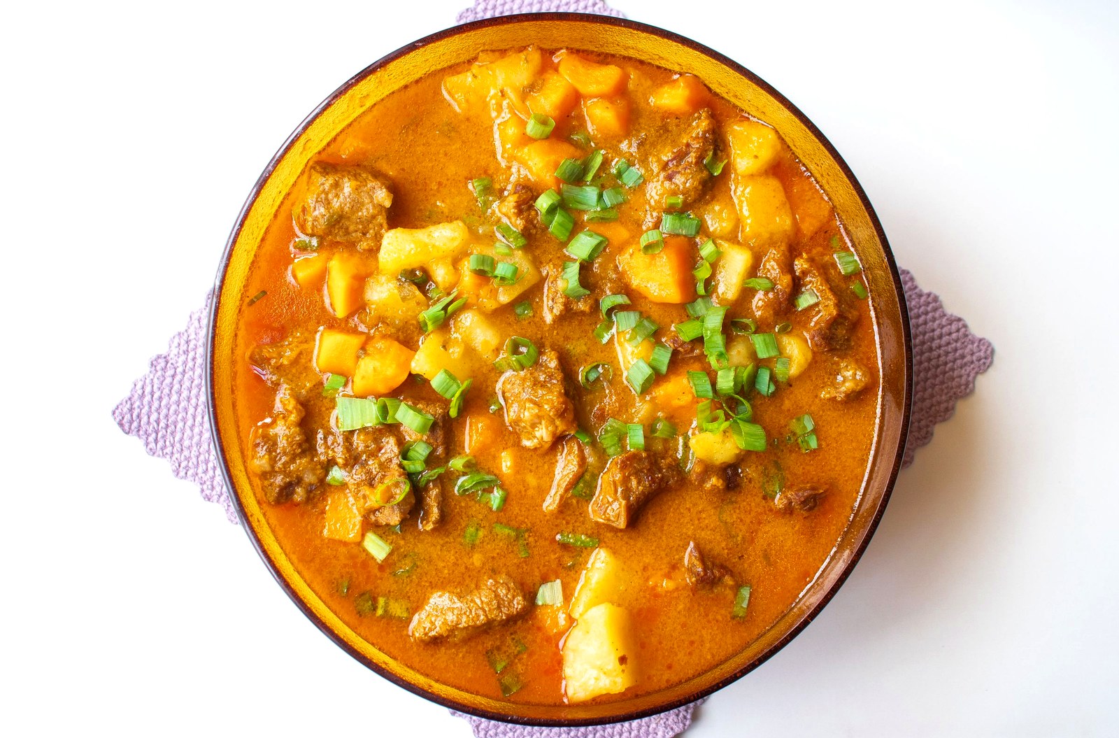 beef stew with potatoes simmering in rich gravy